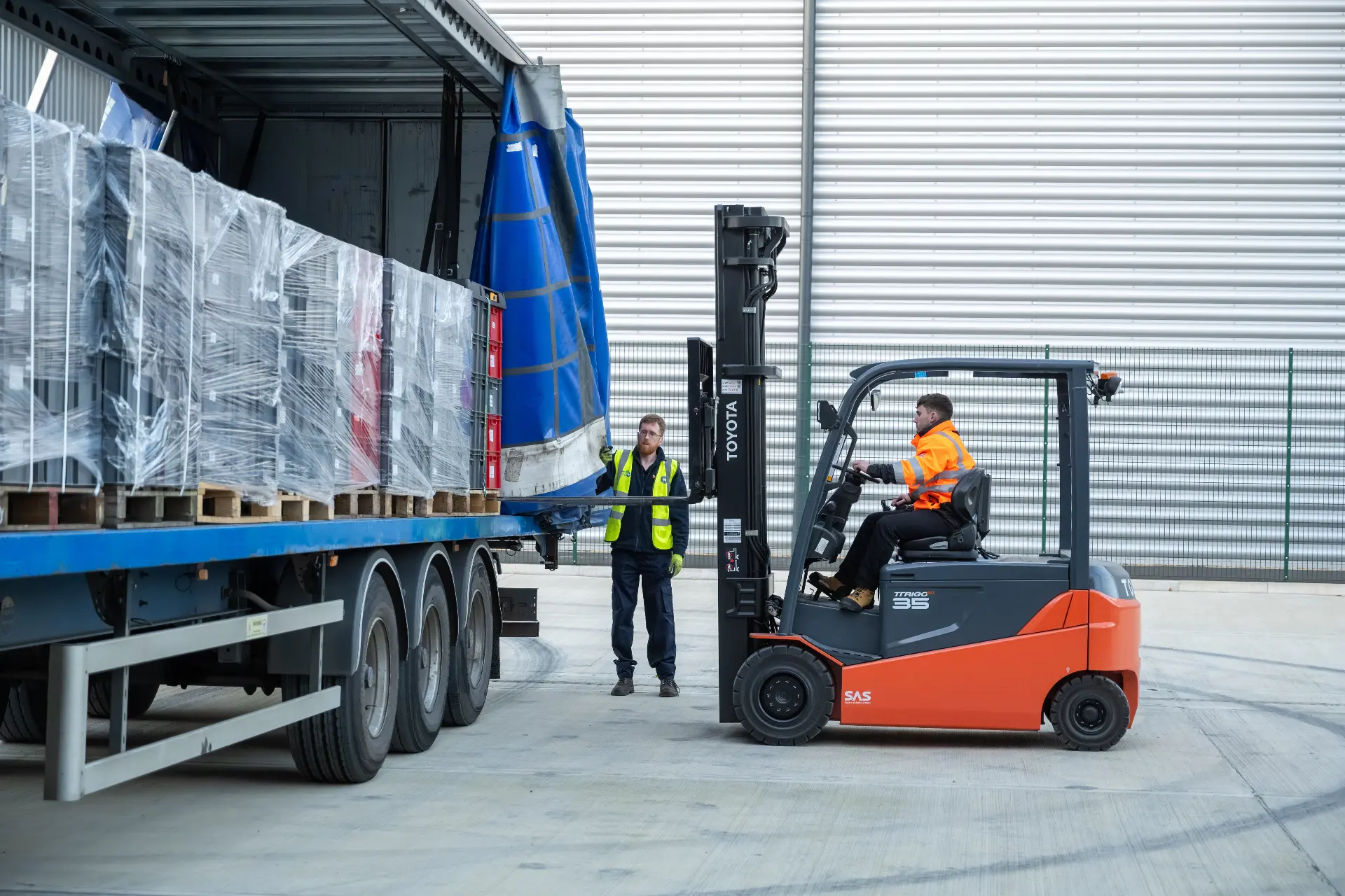 Freight operators loading truck