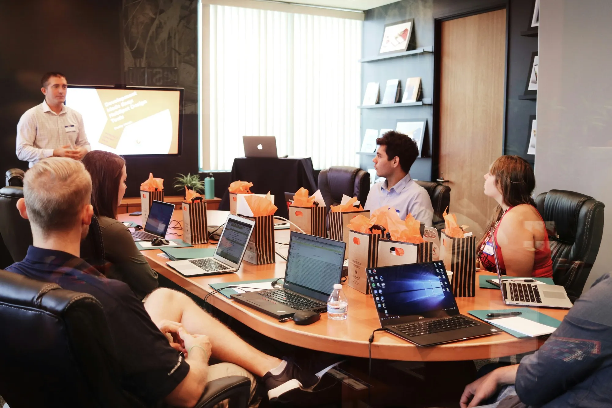 A presentation to a small group around a meeting table