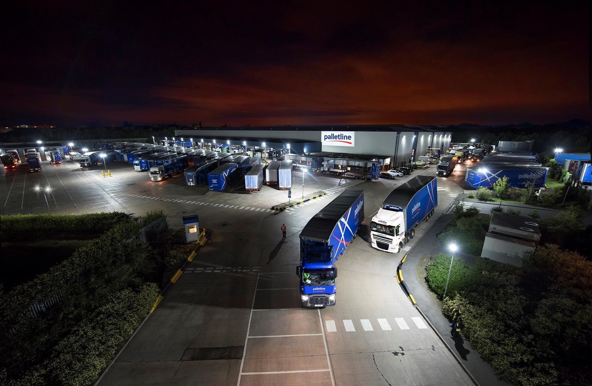 A shared multi-bay HGV charging hub serving several operator networks from a single grid connection