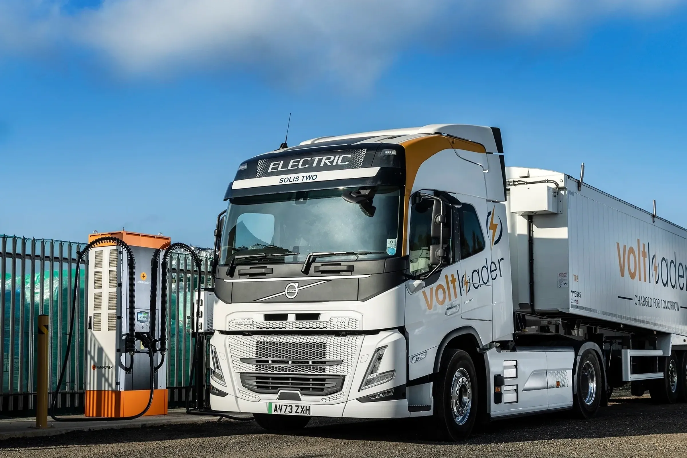 A Welch Group driver plugging in an electric HGV during daily service